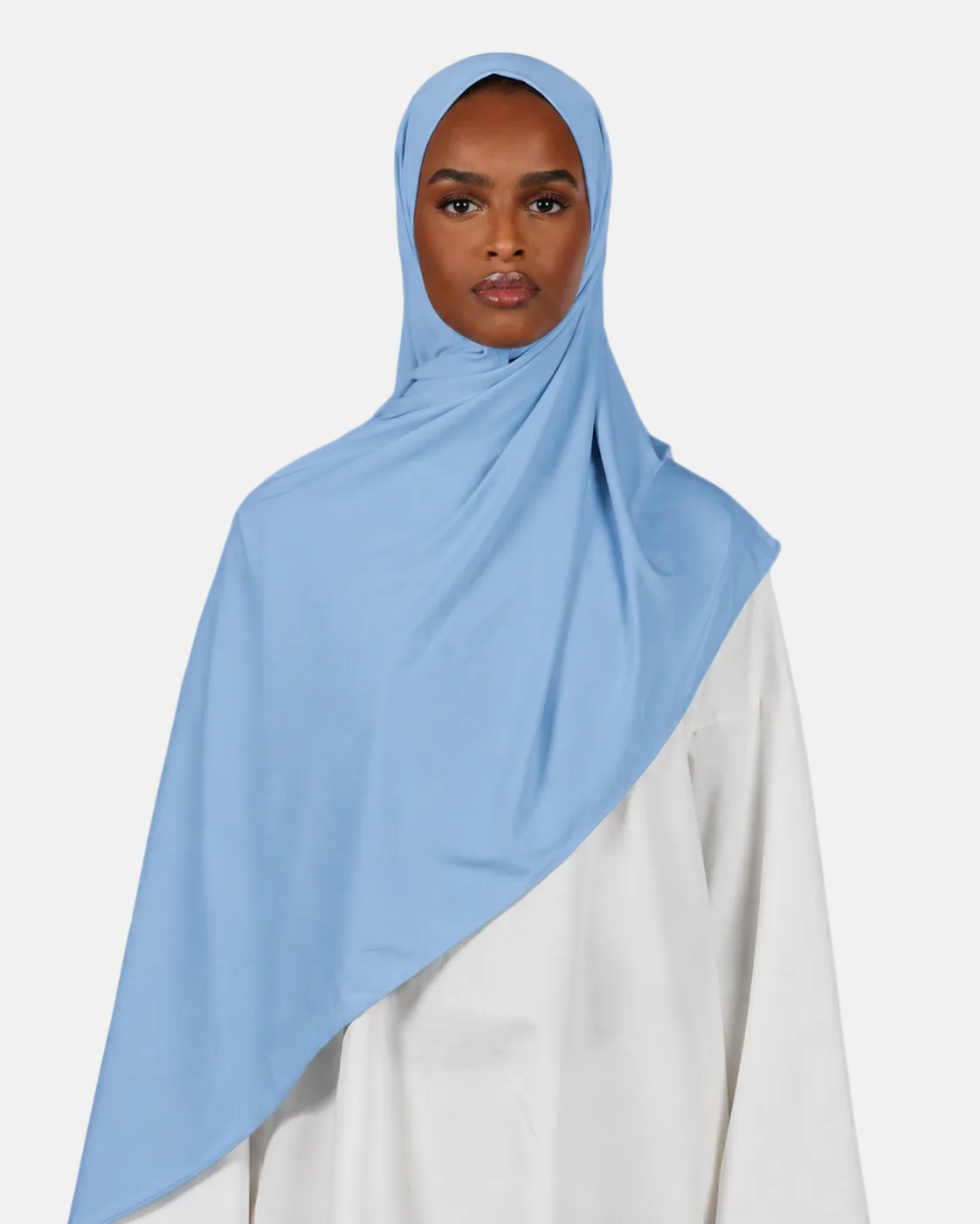 Person wearing a light blue hijab on a white background