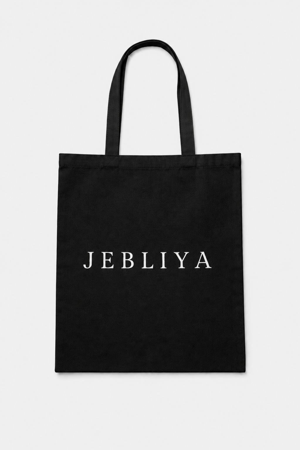 Black tote bag with 'JEBLIYA' text on a white background